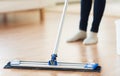 Close up of woman with mop cleaning floor at home Royalty Free Stock Photo