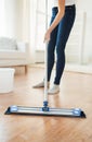 Close up of woman with mop cleaning floor at home Royalty Free Stock Photo