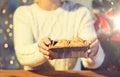 Close up of woman with oat cookies at home