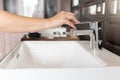 Close up Woman open chrome faucet washbasin to washing hands rubbing with soap for corona virus at water tap. Faucet and water Royalty Free Stock Photo