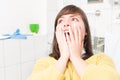 Close-up of woman with open mouth being scared of dentist