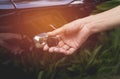 Close-up of woman opening a car door. Hand on handle. Royalty Free Stock Photo
