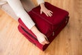 Close up of woman packing travel bag for vacation Royalty Free Stock Photo