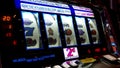 Close up woman playing slot machine