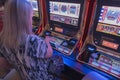 Close-up of woman playing slot machines in Las Vegas hotel casino. Las Vegas. USA