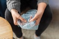 close up of woman popping bubble wrap at home