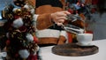 Close up of woman pouring cup of tea from kettle at home Royalty Free Stock Photo