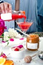 Close-up Of Woman Pouring Strawberry smoothie Royalty Free Stock Photo