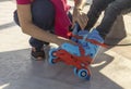 close-up of woman putting skates on child Royalty Free Stock Photo