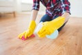 Close up of woman with rag cleaning floor at home Royalty Free Stock Photo