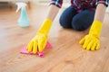 Close up of woman with rag cleaning floor at home Royalty Free Stock Photo