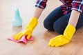 Close up of woman with rag cleaning floor at home Royalty Free Stock Photo