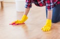 Close up of woman with rag cleaning floor at home Royalty Free Stock Photo