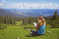 Close-up of woman reading e-book in nature Royalty Free Stock Photo