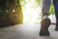 Close up woman running shoes, jogging on the road in a park Royalty Free Stock Photo