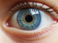 Close-up of the woman\'s blue eye. A perfect vision and reflection in the eye. View precise and straight to the target.