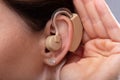 Close-up Of A Woman`s Ear With Hearing Aid Royalty Free Stock Photo