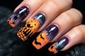 Close up of woman\'s fingernails with Halloween nail art