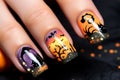 Close up of woman\'s fingernails with Halloween nail art