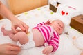 Woman changing the baby`s diaper Royalty Free Stock Photo