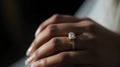 Close-up of a woman\'s hand holding a diamond ring. Royalty Free Stock Photo