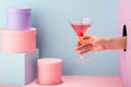 Close-up on woman`s hand holding a glass of red prosecco