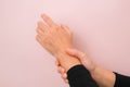 Close-up of woman's hand holding her painful wrist from Arthritis or Carpal Tunnel Syndrome Royalty Free Stock Photo
