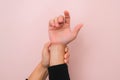 Close-up of woman's hand holding her painful wrist from Arthritis or Carpal Tunnel Syndrome Royalty Free Stock Photo