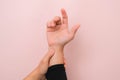 Close-up of woman's hand holding her painful wrist from Arthritis or Carpal Tunnel Syndrome Royalty Free Stock Photo