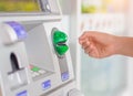 Close-up of woman`s hand inserting debit card into an ATM machin Royalty Free Stock Photo