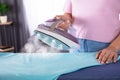 Close-up Of A Woman Ironing Cloth Royalty Free Stock Photo