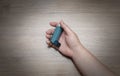 Close-up of woman`s hand lying on the ground with holding a pressurized cartridge inhaler extended pharynx, Bronchodilator.