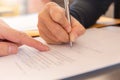 Close up of woman`s hand with pen signing document, Deal concept Royalty Free Stock Photo