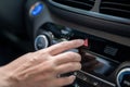 Close-up of a woman`s hand pressing the emergency button in a new car Royalty Free Stock Photo