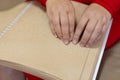 close-up of a woman's hand reading a braille book Royalty Free Stock Photo