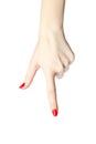 Close-up of woman`s hand with red nails pointing index finger on white background. Royalty Free Stock Photo