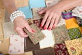 Close up of woman's hand sewing patchwork Royalty Free Stock Photo