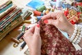 Close up of woman's hand sewing patchwork Royalty Free Stock Photo