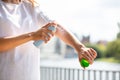 Woman Spraying Anti Insect Deet Spray On Her Hand Royalty Free Stock Photo