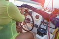 Close-up of a woman`s hand on the steering wheel of a yacht. Yachts woman`s hands on the yacht`s steering wheel. Close view Royalty Free Stock Photo