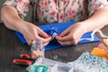 Close-up of woman's hand stitching quilting