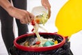 Woman Throwing Salad In Trash Bin