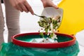 Woman Throwing Vegetables In Trash Bin Royalty Free Stock Photo