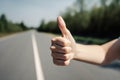 Close-Up Of A Woman\'s Hand With A Thumbs-Up Sign, Standing On The Side Of The Road Looking For A Ride - Generative AI