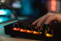 Close up of a women`s hand typing on a gamer