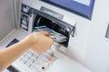 Close up of a woman`s hand withdrawing cash, euro bills from the ATM bank machine. Finance customer and banking service concept Royalty Free Stock Photo