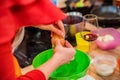 Female hands add egg in plastic bowl Royalty Free Stock Photo