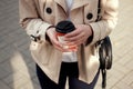 Close up woman`s hands holding cup of coffee. Royalty Free Stock Photo