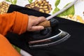 Close-up of woman\'s hands ironing. Hands of senior woman ironing a towel Royalty Free Stock Photo