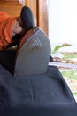 Close-up of woman's hands ironing. Hands of senior woman ironing a towel Royalty Free Stock Photo